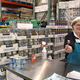 Woman holding out Costco sample on a toothpick